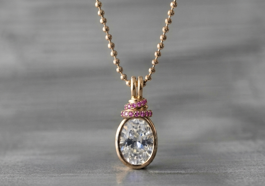 Custom gold pendant with an oval stone