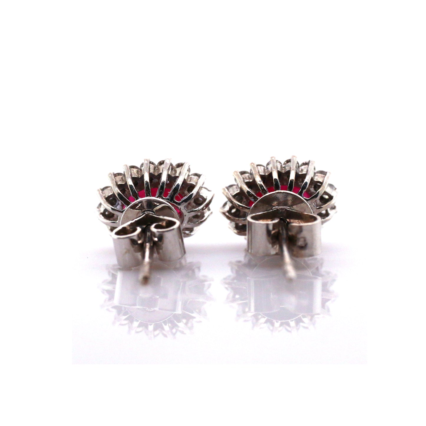 Beautiful and Almost Flawless Ruby has been Elegantly set with Natural Diamonds to create this 18kt White Gold Earring.
