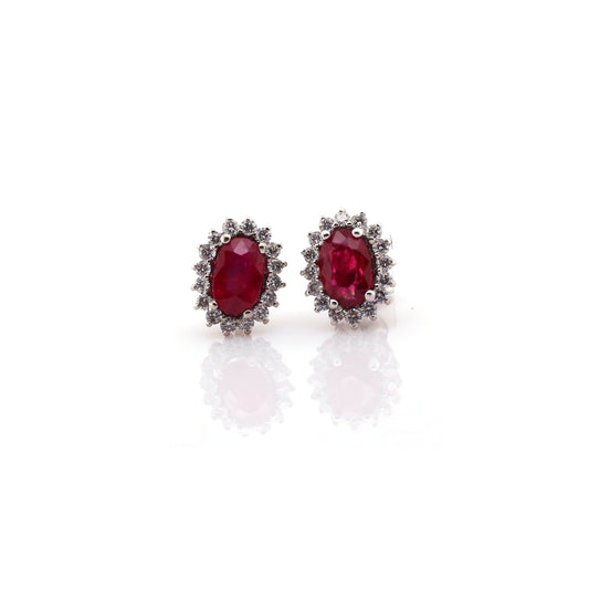 Beautiful and Almost Flawless Ruby has been Elegantly set with Natural Diamonds to create this 18kt White Gold Earring.