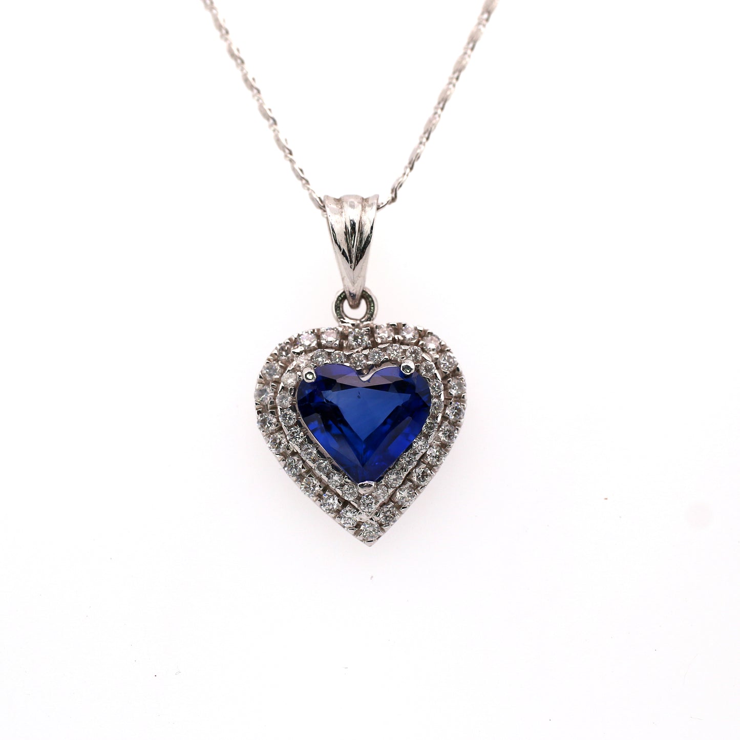 Stunning Heart Pendant Elaborated with Blue Sapphire Beauty is enhanced by addition of White Diamond