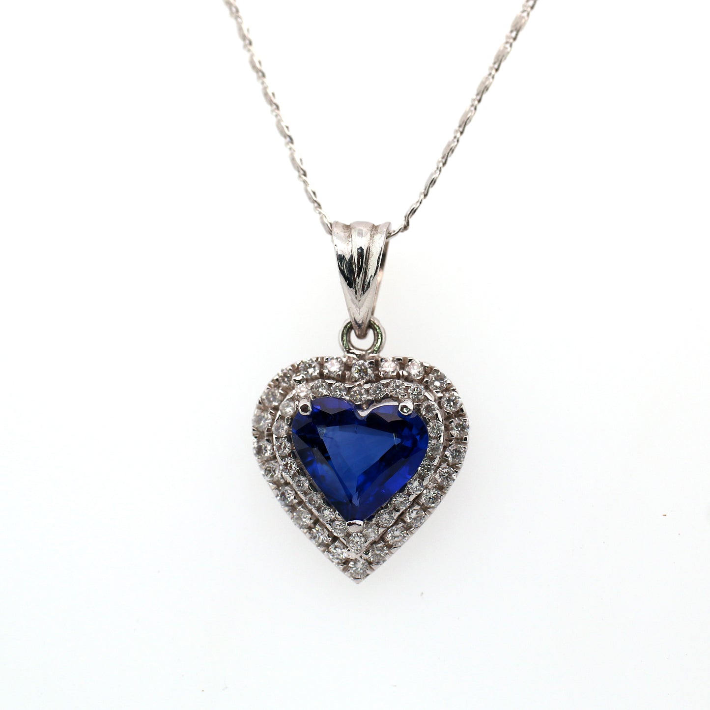Stunning Heart Pendant Elaborated with Blue Sapphire Beauty is enhanced by addition of White Diamond