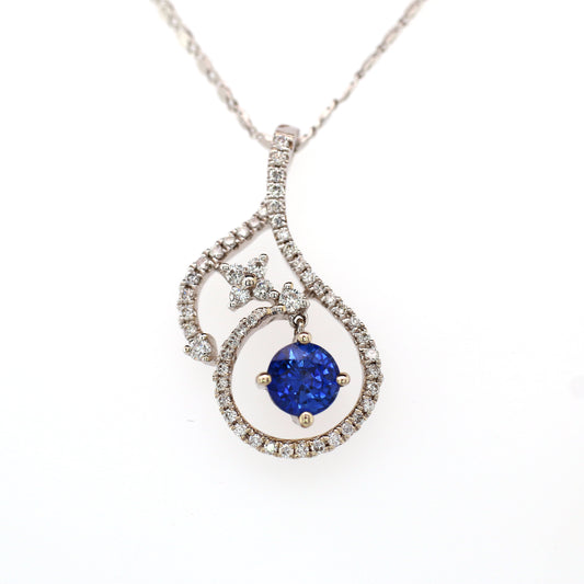 Vivid Blue Sapphire has been Elegantly set with Natural Diamonds to create this 18kt White Gold Pendant.
