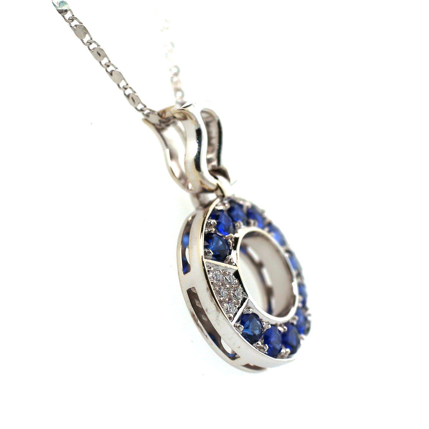 Round Blue Sapphires & Brilliant Diamonds Pendant in a cool pattern Mounted in 18k White Gold.