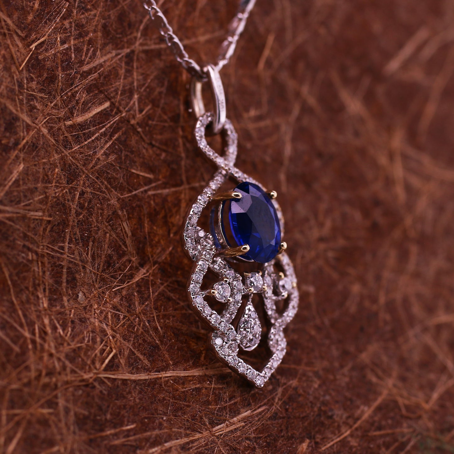 Vivid Blue Sapphire 18K White Gold Pendant has been Elegantly set with Natural Halo Diamonds