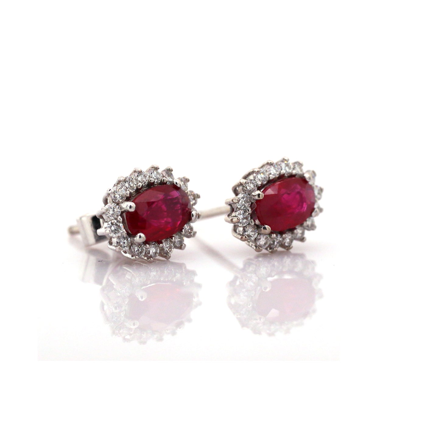 Beautiful and Almost Flawless Ruby has been Elegantly set with Natural Diamonds to create this 18kt White Gold Earring.