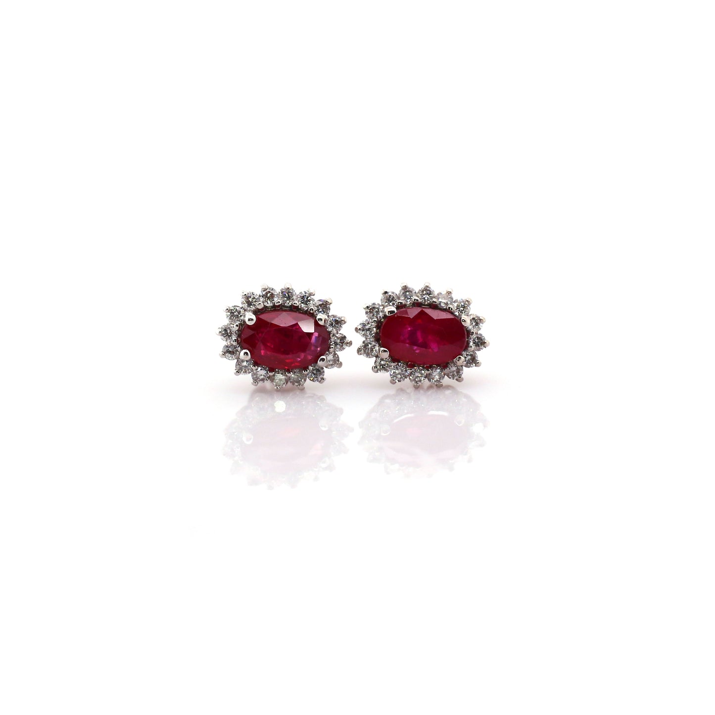 Beautiful and Almost Flawless Ruby has been Elegantly set with Natural Diamonds to create this 18kt White Gold Earring.