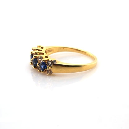 White sapphire and Blue sapphire ring in 18K yellow gold
