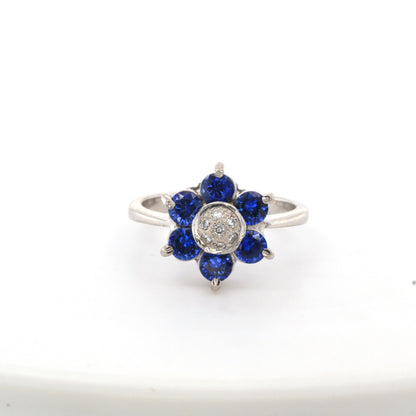 Blue sapphire and diamond cluster ring in 18K white gold