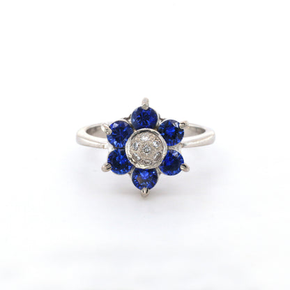 Blue sapphire and diamond cluster ring in 18K white gold
