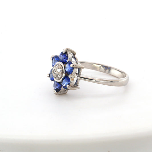 Blue sapphire and diamond cluster ring in 18K white gold