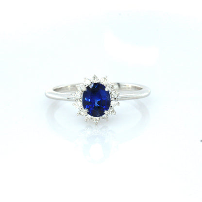 Blue sapphire and diamond cluster ring in 18K white gold