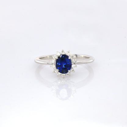 Blue sapphire and diamond cluster ring in 18K white gold