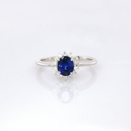 Blue sapphire and diamond cluster ring in 18K white gold