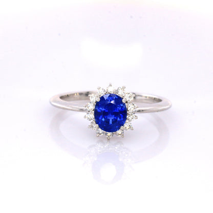 Blue sapphire and diamond cluster ring in 18K white gold