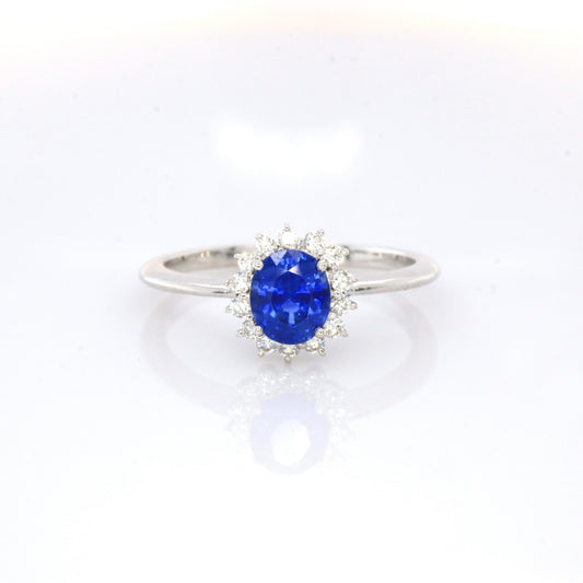 Blue sapphire and diamond cluster ring in 18K white gold