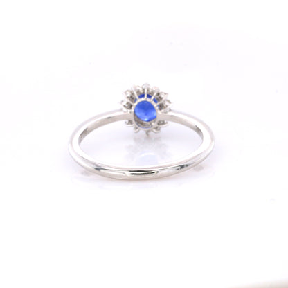 Blue sapphire and diamond cluster ring in 18K white gold
