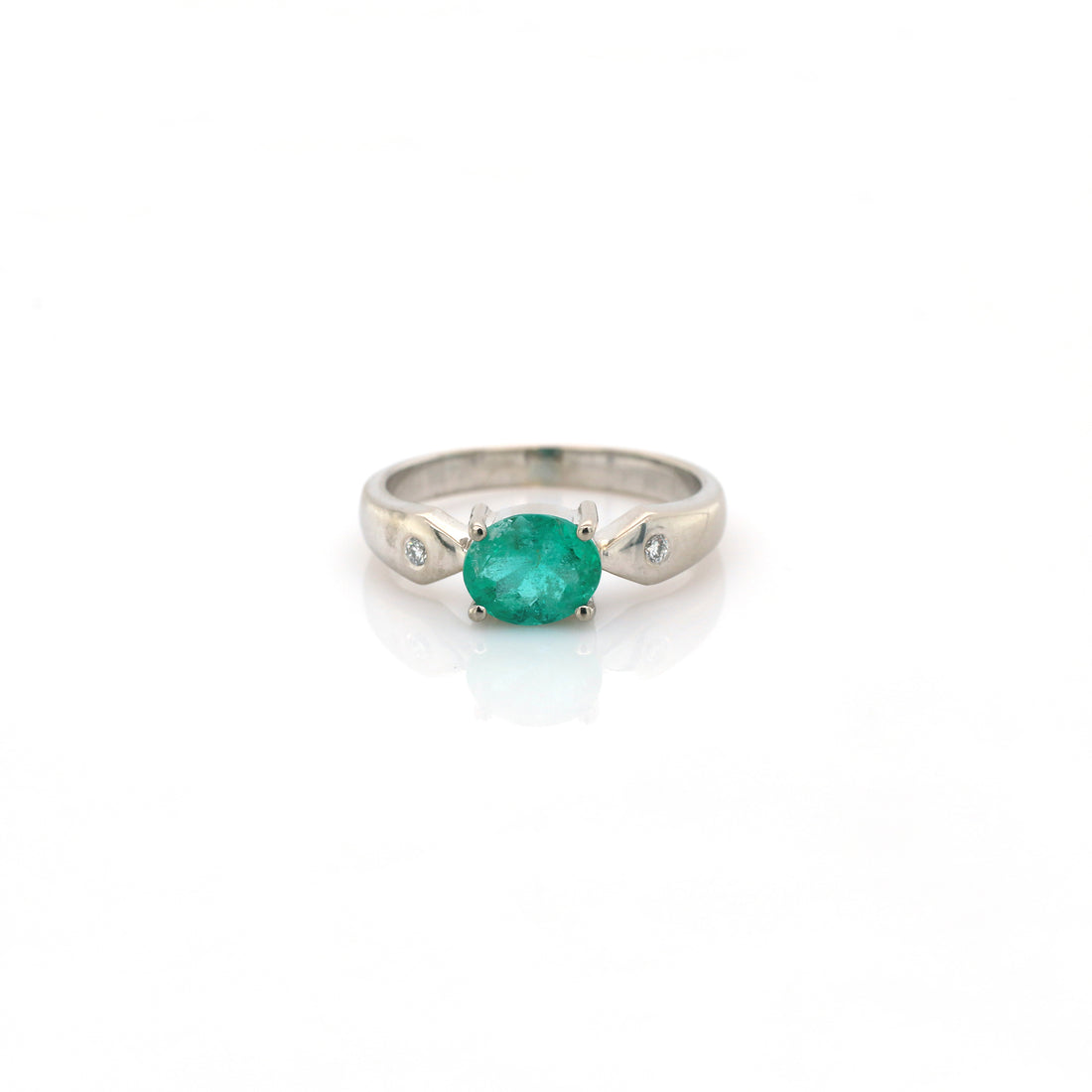 diamond and emerald ring in 18K white gold