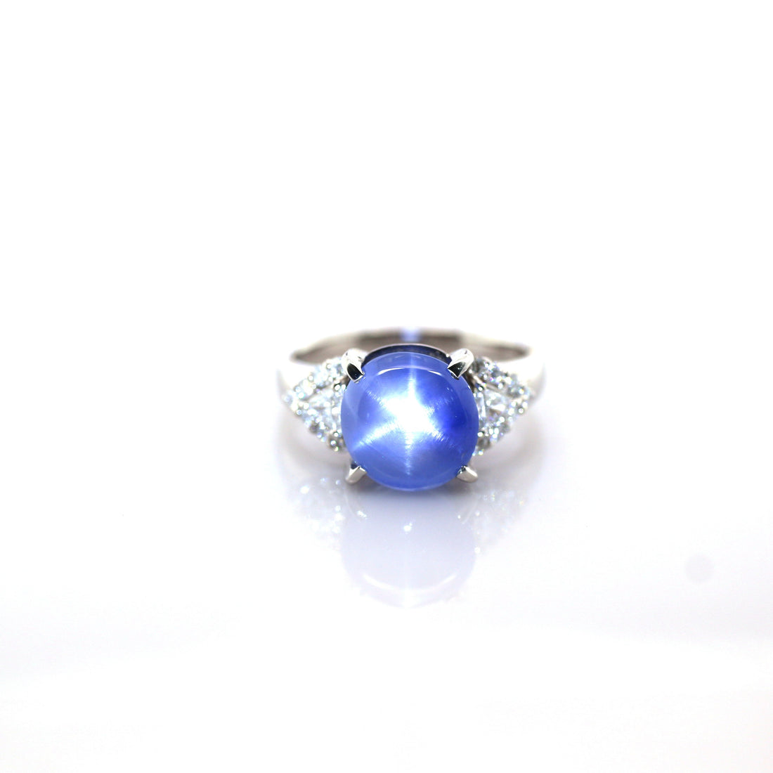 Blue star sapphire and diamond ring in 950 platinum