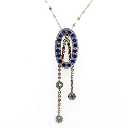 White sapphire and Blue sapphire pendant in 18K white gold