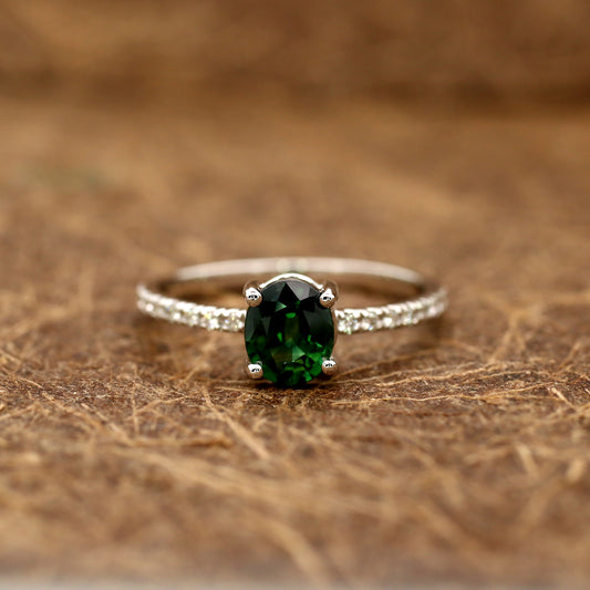 Teal sapphire and diamond ring in 18K white gold
