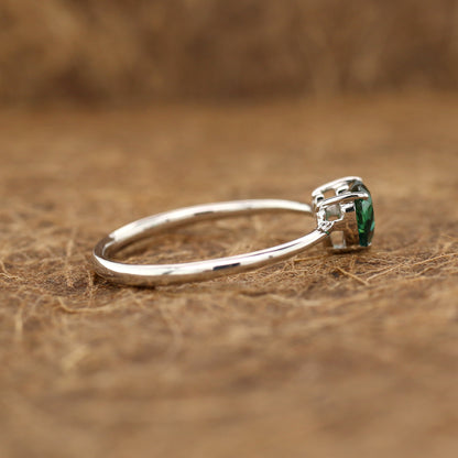 Teal sapphire and diamond ring in 18K white gold