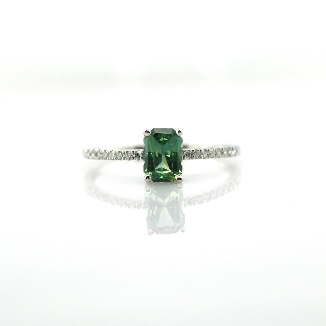 Teal sapphire and diamond ring in 18K white gold