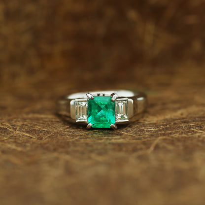 diamond and emerald ring in 950 platinum