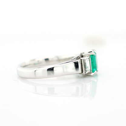 diamond and emerald ring in 950 platinum