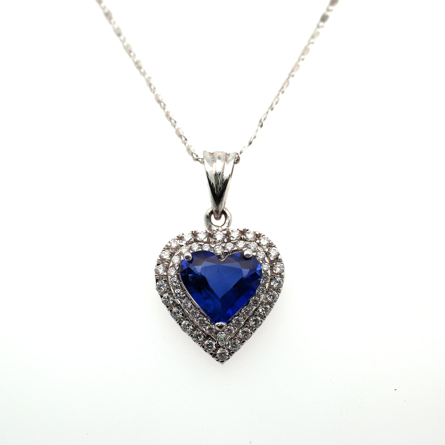 Stunning Heart Pendant Elaborated with Blue Sapphire Beauty is enhanced by addition of White Diamond