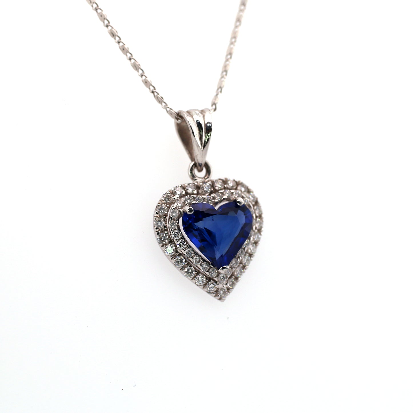 Stunning Heart Pendant Elaborated with Blue Sapphire Beauty is enhanced by addition of White Diamond