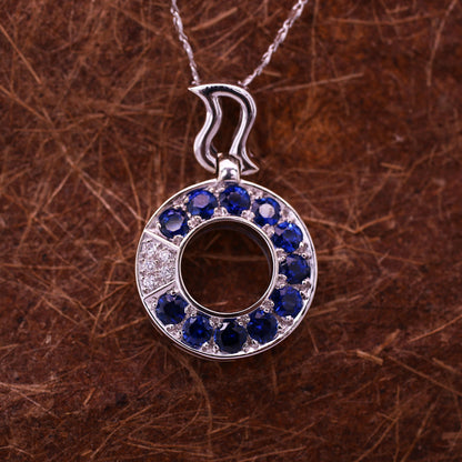 Blue sapphire and diamond pendant in 18K white gold
