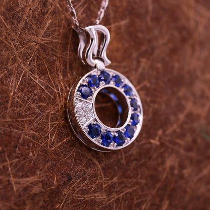 Blue sapphire and diamond pendant in 18K white gold
