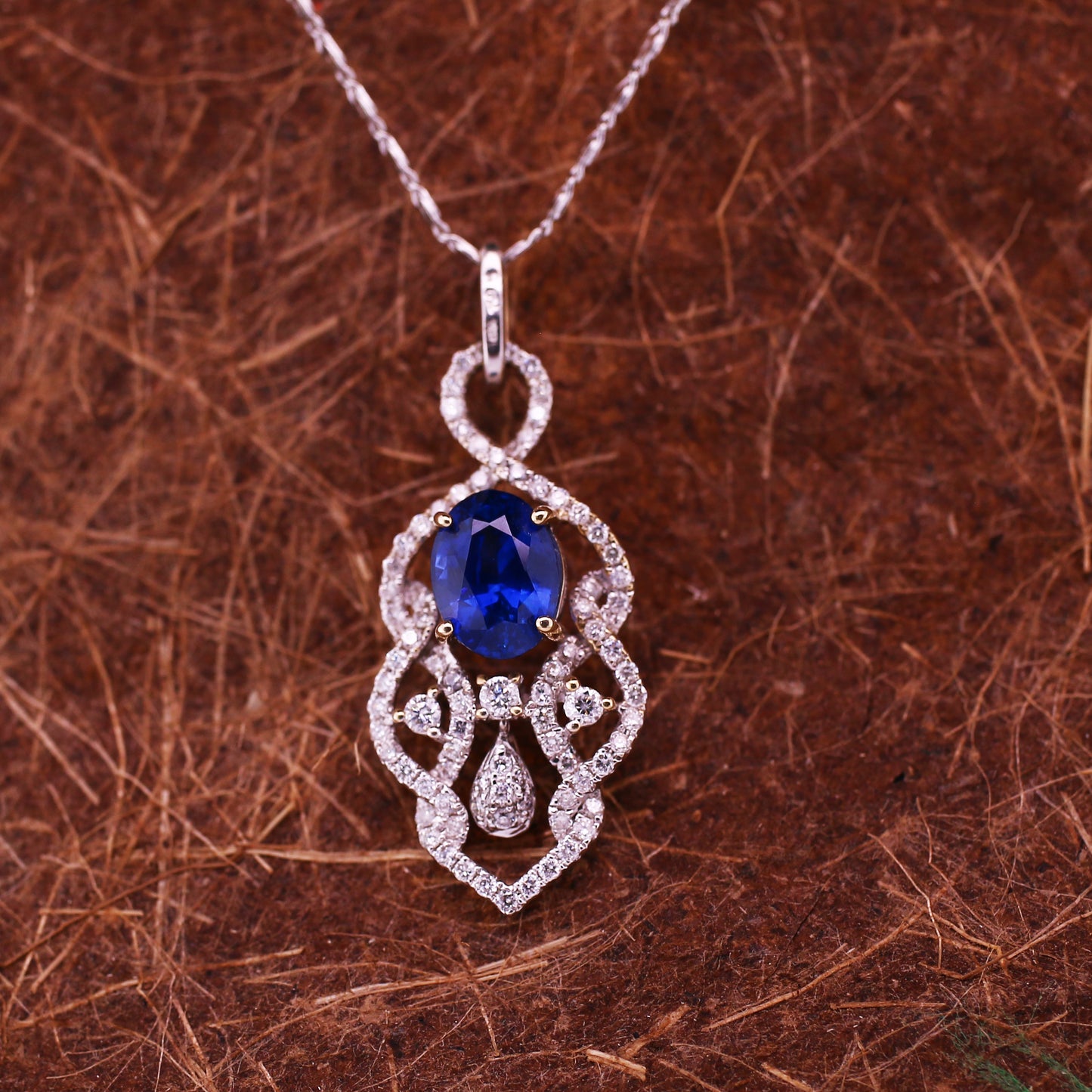 Vivid Blue Sapphire 18K White Gold Pendant  has been Elegantly set with Natural Halo Diamonds
