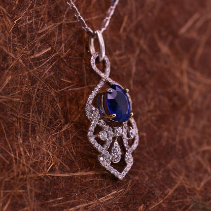 Blue sapphire and diamond pendant in 18K white gold