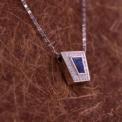 Blue sapphire and diamond pendant in 18K white gold