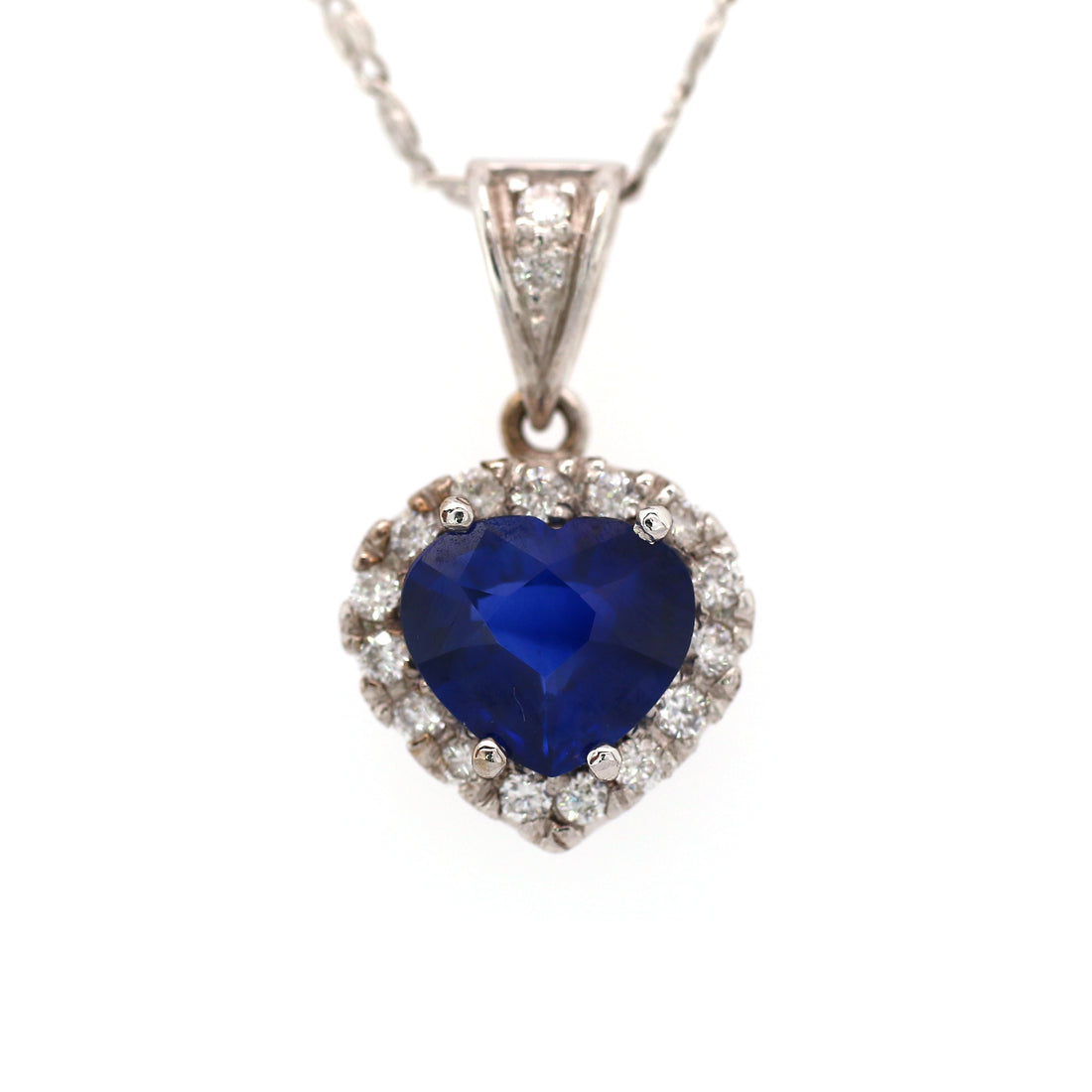 Blue sapphire and diamond pendant in 18K white gold