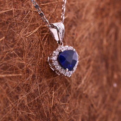 Blue sapphire and diamond pendant in 18K white gold