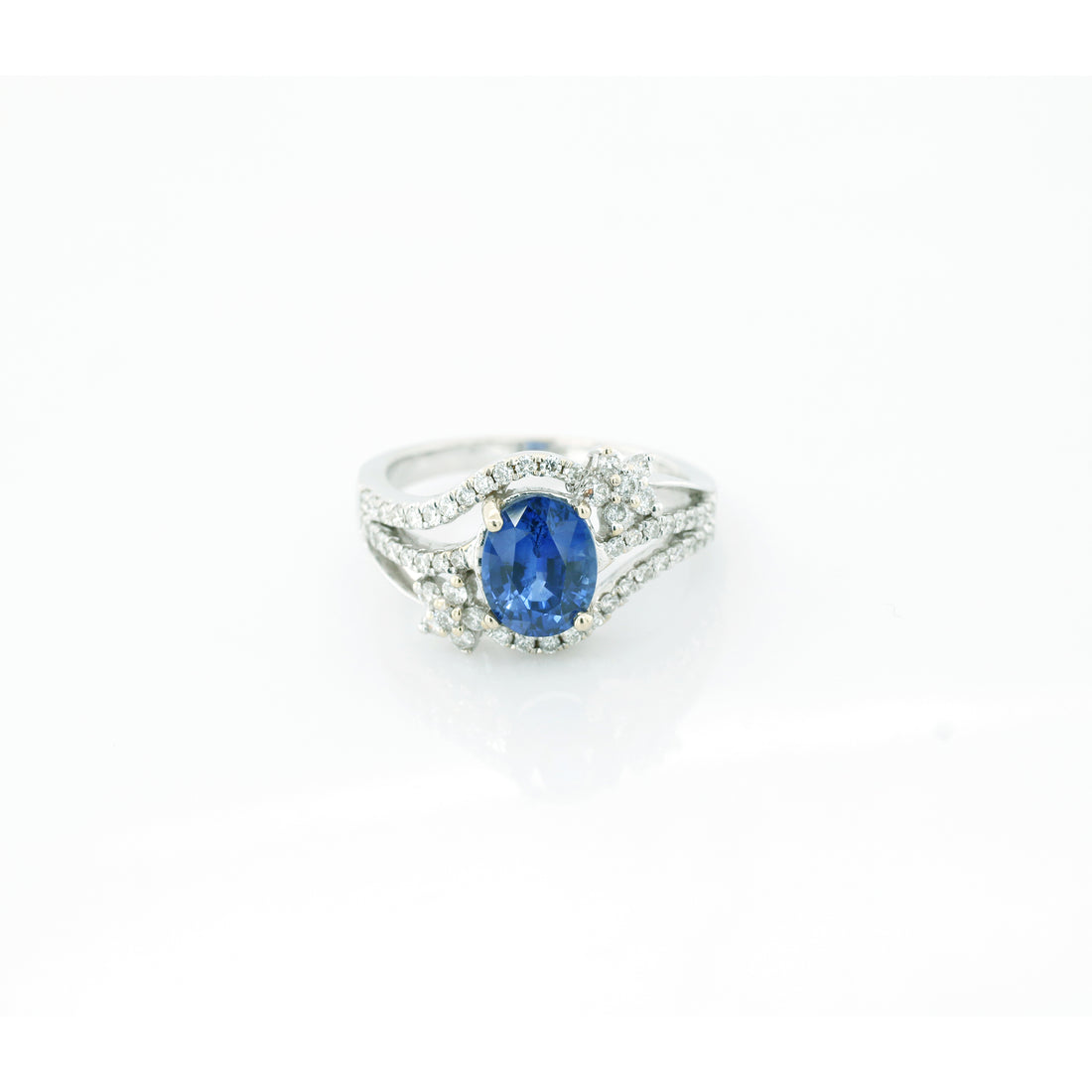 Blue sapphire and diamond cocktail stud ring in 18K white gold